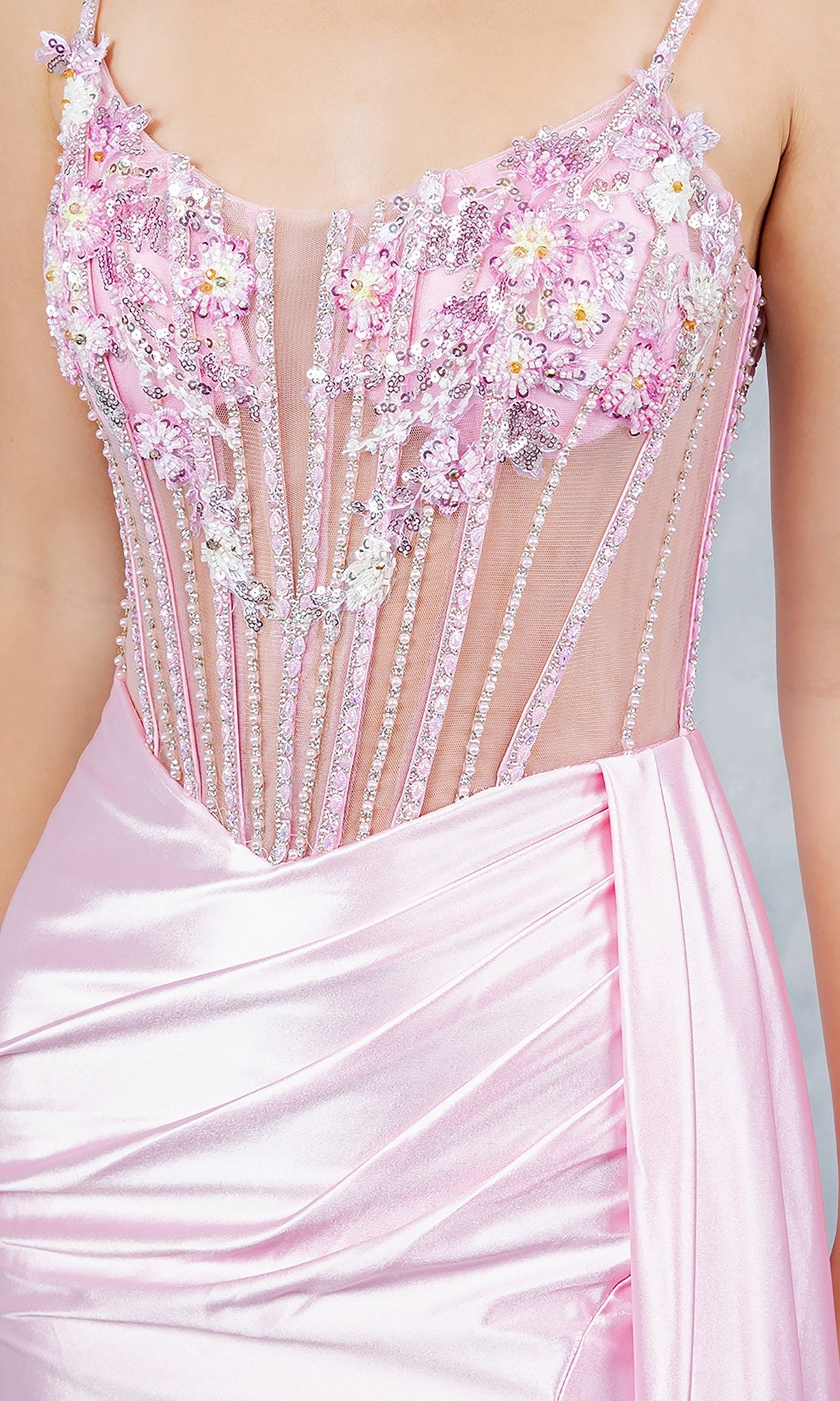 A close-up of the Cinderella Couture 8593J Long Prom Dress, featuring pink satin, sheer panels, floral beading, bead accents, and a draped sash at the waist.